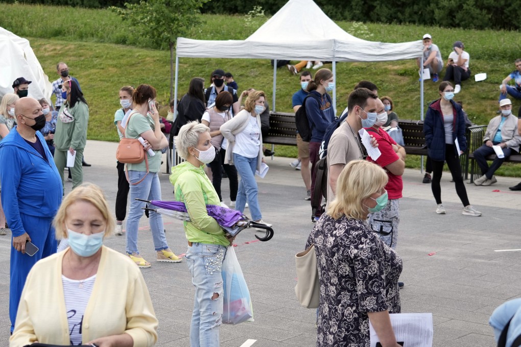 People wait in line to get a Covid-19 vaccine in Moscow’s outskirts, Russia. Photo: AP