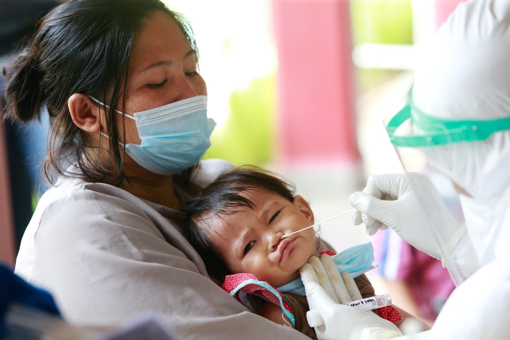 An Indonesian infant is tested for Covid-19 in Jakarta. Photo: Reuters
