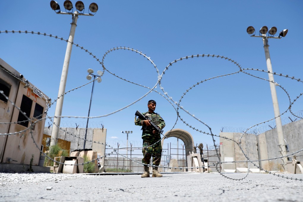 An Afghan National Army soldier stands guard at the gate of Bagram US air base on Friday, on the day the last of American troops vacated it. Photo: Reuters