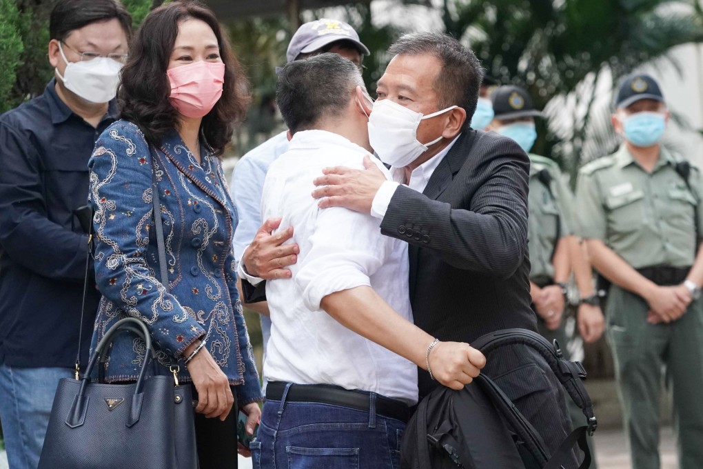 Peter Chan (in black suit) hugs a member of a group of people who had come to receive him after his release. Photo: Felix Wong