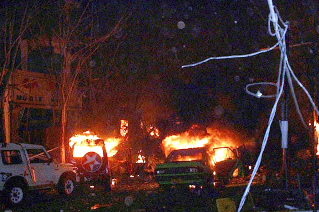 Buildings and cars burn after a bomb blast in the tourist site of Kuta, Bali, in October 2002. Photo: AFP