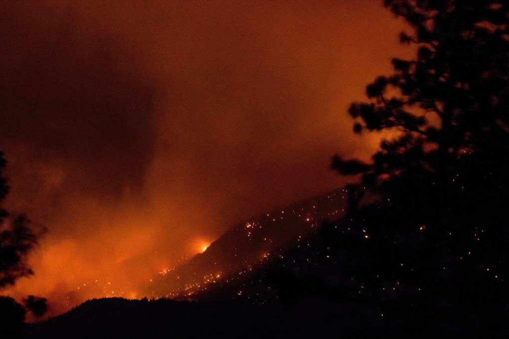 Fire burns above the Fraser River Valley near Lytton, British Columbia, Canada on Friday. Photo: Bloomberg