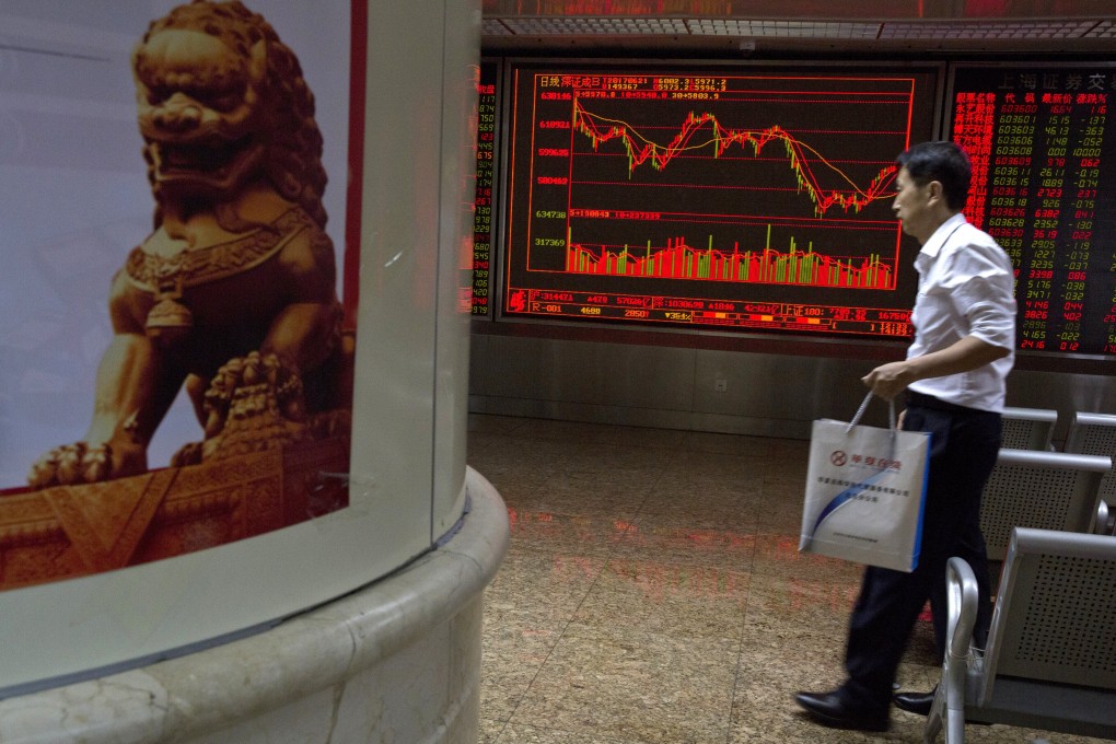 A man walks past an electronic board displaying local stock prices and indexes outside at a brokerage in Beijing. Photo: AP