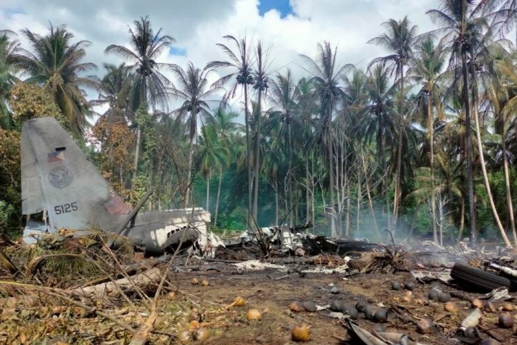 The remains of the Lockheed C-130 plane carrying troops that crashed on landing in Patikul, Sulu province, Philippines. Photo: Reuters