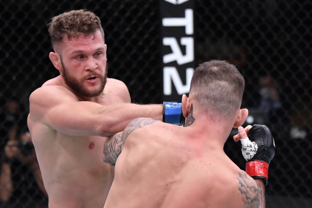 Rafael Fiziev punches Renato Moicano in their lightweight bout at UFC 256. Photos: Jeff Bottari/Zuffa LLC