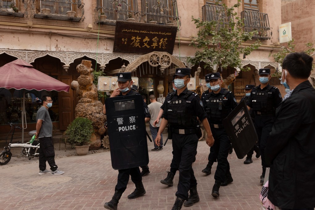 Police officers patrol in the old city in Kashgar, in Xinjiang. Photo: Reuters
