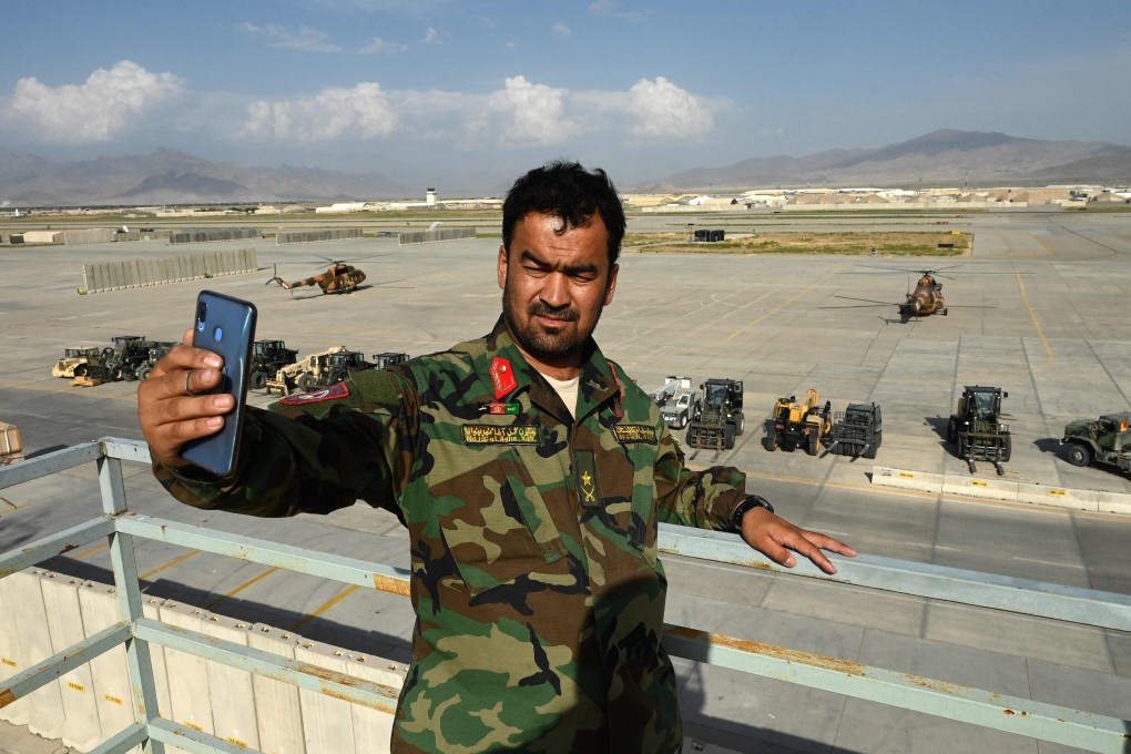 An Afghan government soldier take a selfie inside Bagram airbase after US and Nato troops left. Photo: AFP
