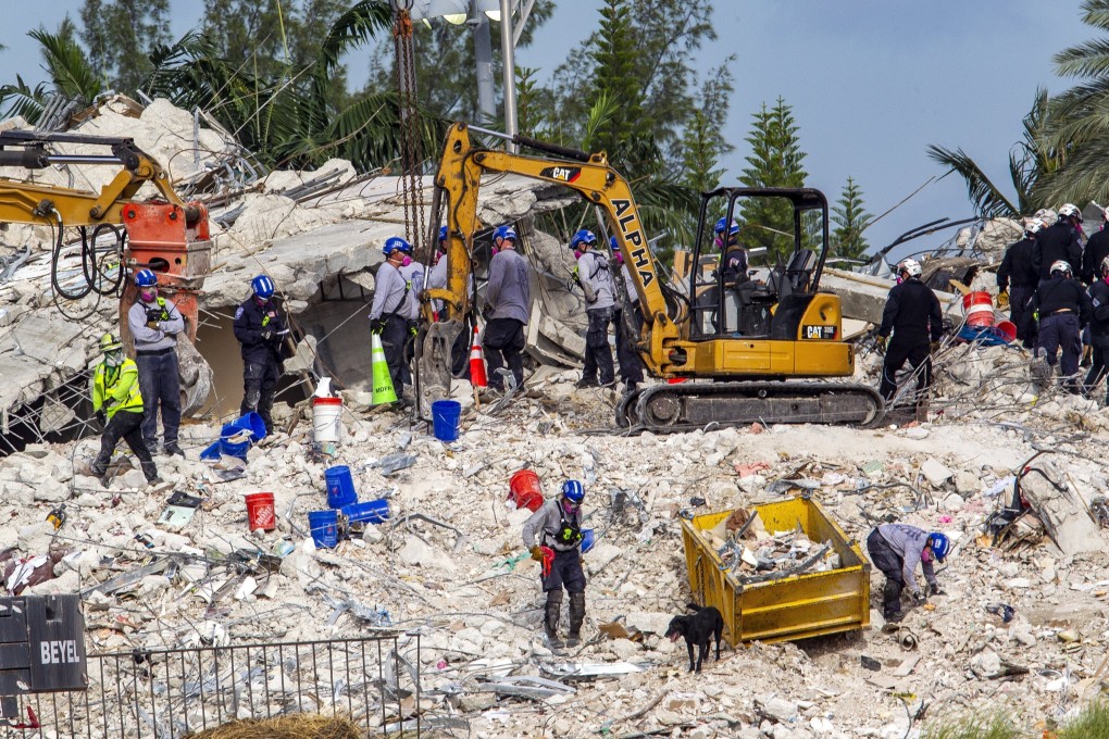 Rescuers search for victims at a collapsed South Florida condo building. Photo: Miami Herald via AP