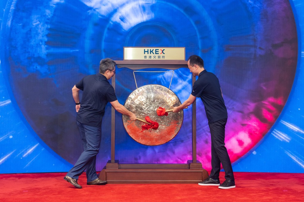 Brian Gu, vice chairman of XPeng and managing director Charles Zhang (right), are seen hitting the gong on its Hong Kong trading debut on July 7, 2021. Photo: HKEX