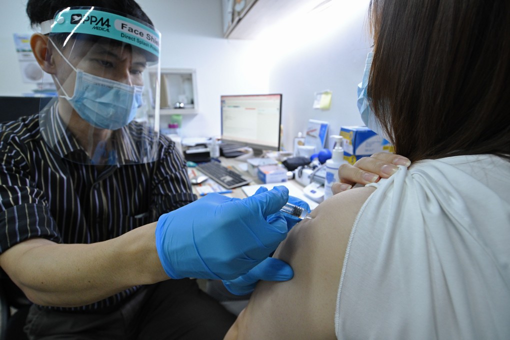 A doctor administers Sinovac’s Covid-19 vaccine to a woman at a private clinic in Singapore on Tuesday. Photo: Xinhua