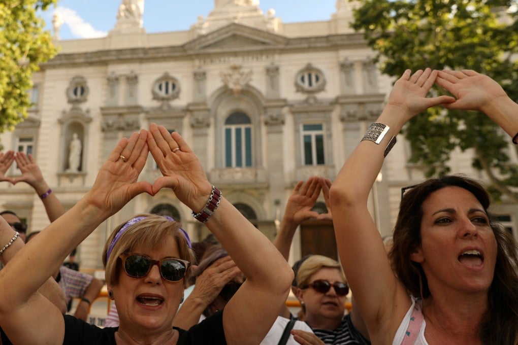 Women gather after Spain’s top court finds five men guilty of rape in Madrid on June 21, 2019. Photo: Reuters
