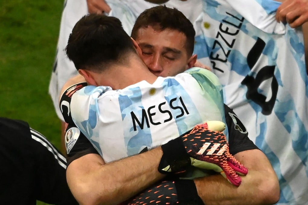 Argentina goalkeeper Emiliano Martinez and captain Lionel Messi celebrate after winning their Copa America semi-final against Colombia in a penalty shoot-out at the Mane Garrincha Stadium in Brasilia. Photo: AFP