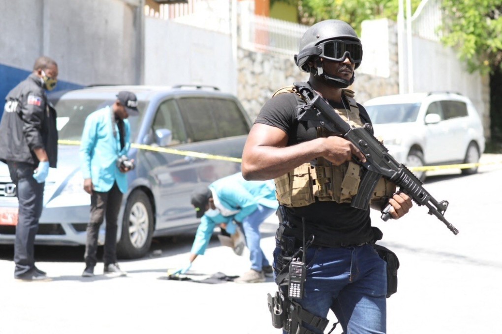 Members of the Haitian police and forensics look for evidence outside the presidential residence in Port-au-Prince, Haiti. Photo: AFP