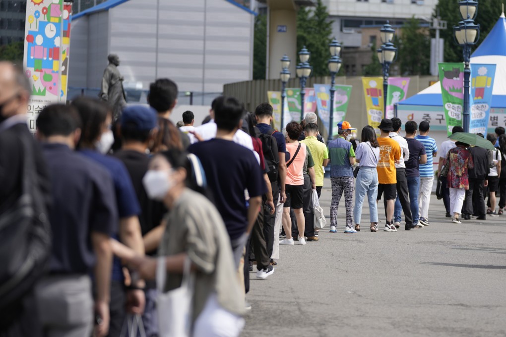 People queue for Covid-19 testing in Seoul. South Korea on Thursday confirmed more than 1,000 new cases for the second day in a row. Photo: AP