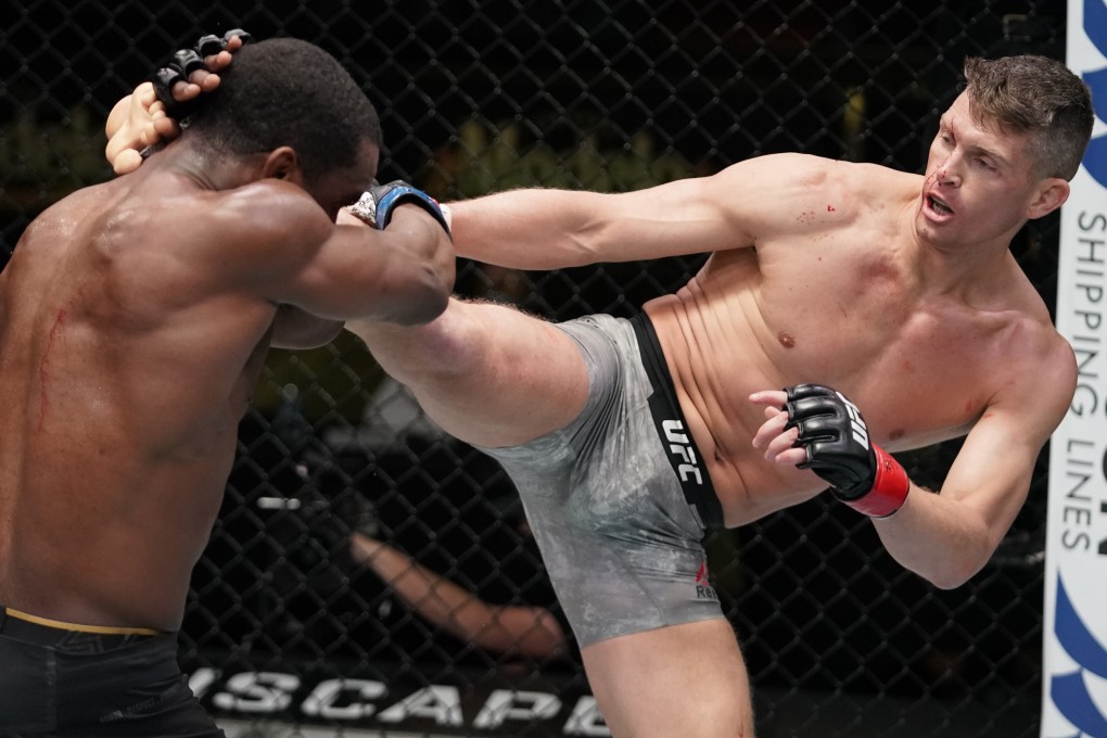 Stephen Thompson kicks Geoff Neal in their welterweight fight on December 19, 2020 in Las Vegas, Nevada. Photo: Cooper Neill/Zuffa LLC