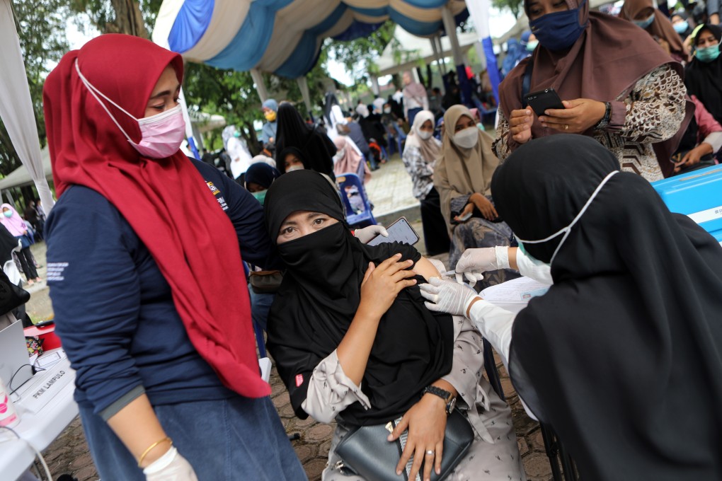 A woman receives a dose of the Sinovac Covid-19 vaccine in Banda Aceh, Indonesia. Photo: EPA-EFE