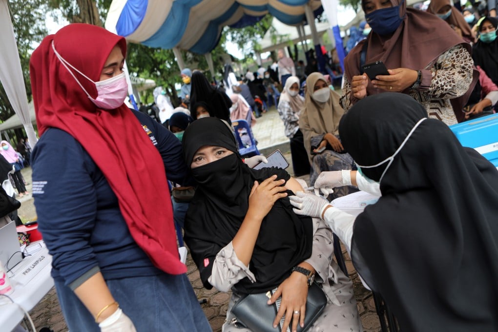 A woman receives a dose of the Sinovac Covid-19 vaccine in Banda Aceh, Indonesia. Photo: EPA-EFE