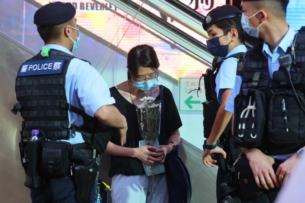 Flowers were left at the scene of a knife attack on a police officer. The assailant died after turning the weapon on himself. Photo: Dickson Lee