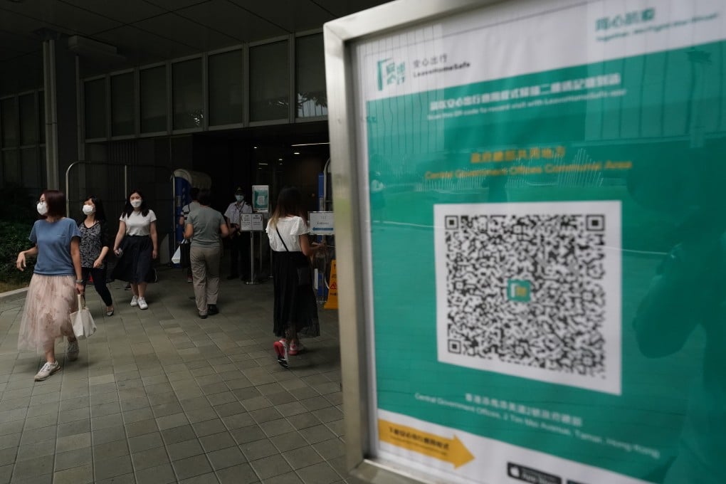 A sign outside government headquarters urges people to use the official Covid-19 risk-exposure app. Photo: Felix Wong