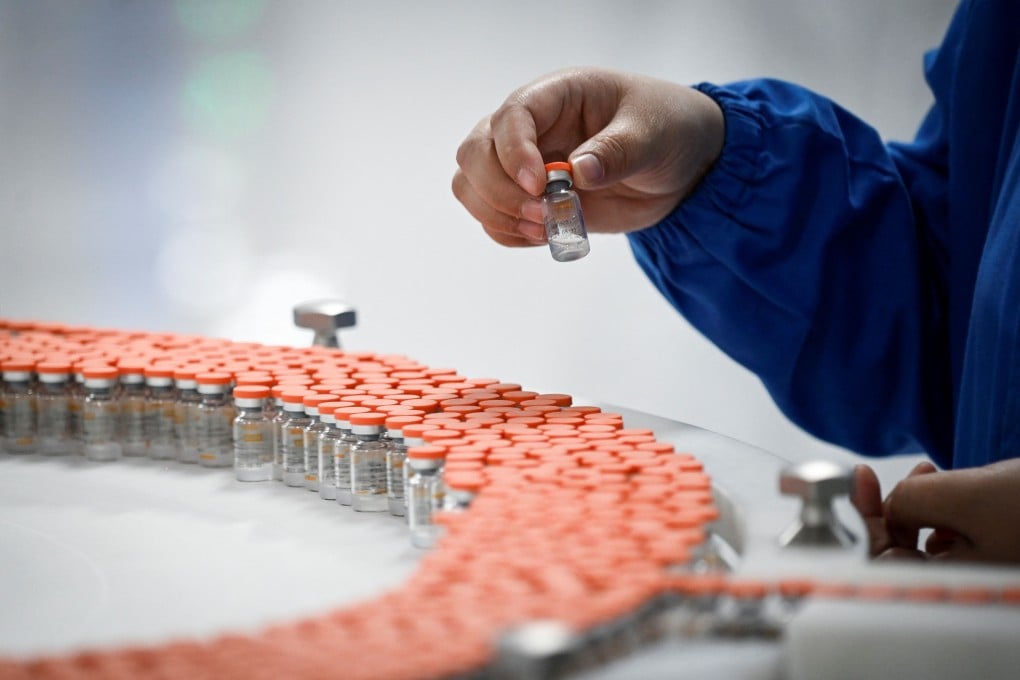 A Sinovac employee working on the firm’s Covid-19 vaccine last year. It is now the world’s most used vaccine. Photo: AFP