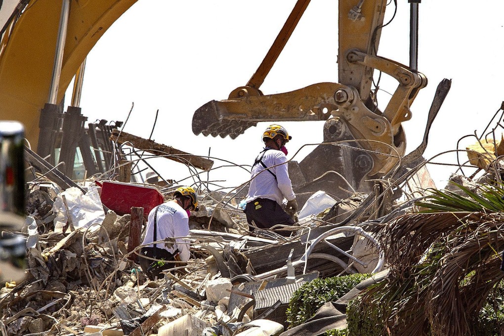 Rescue teams search the rubble of the Champlain Towers South in Surfside, Florida on Thursday. Photo: Miami Herald via AP