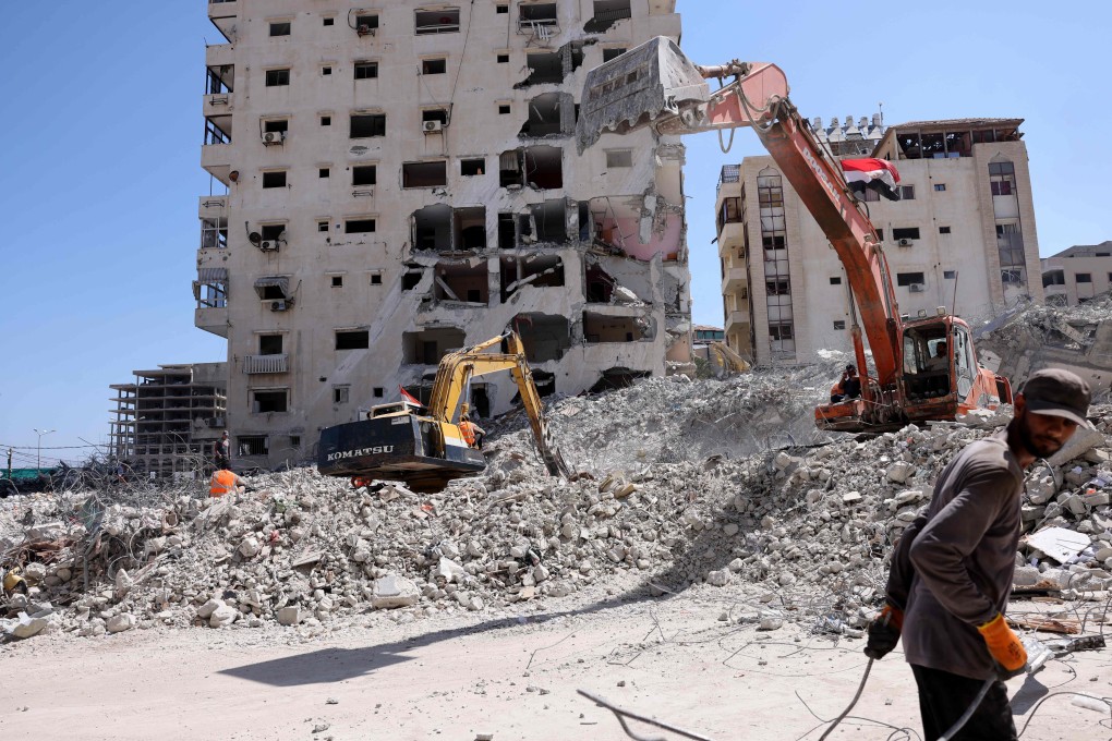 Excavators clear the rubble in Gaza City on June 23 following the destruction of several buildings by Israeli strikes. Photo: AFP