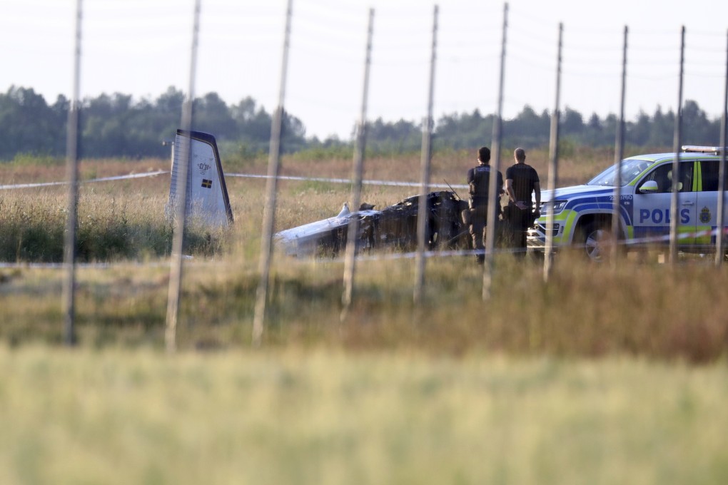 Emergency services at the scene of small aircraft crash at Orebro Airport in Sweden on Thursday. Photo: TT News Agency via AP