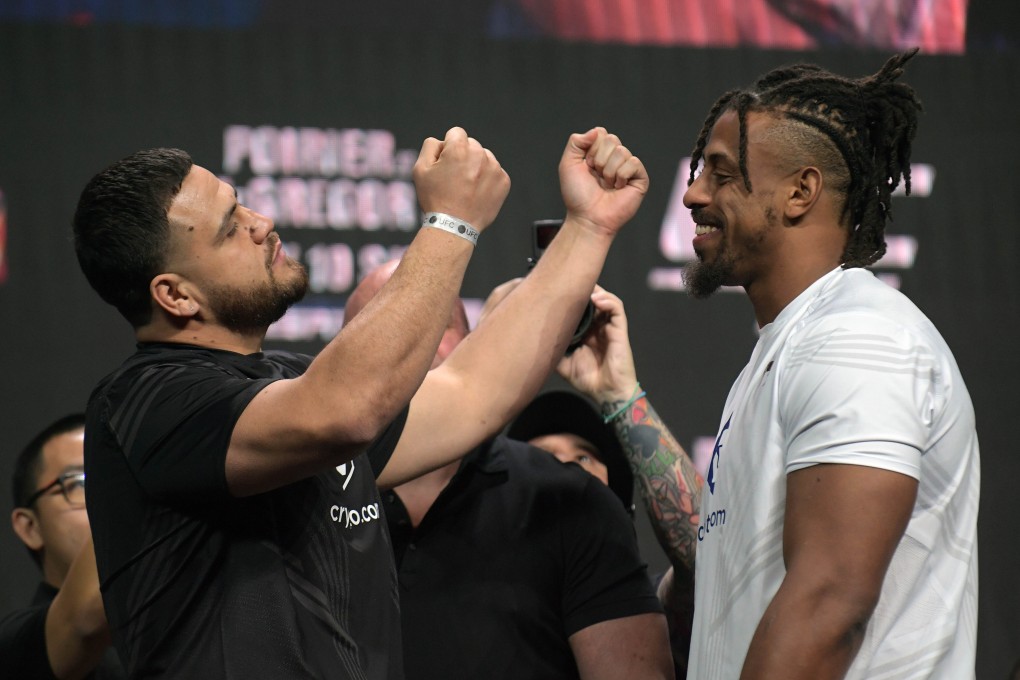 Tai Tuivasa and Greg Hardy stand face to face during the ceremonial weigh-ins for UFC 264 at T-Mobile Arena. Photo: USA TODAY Sports