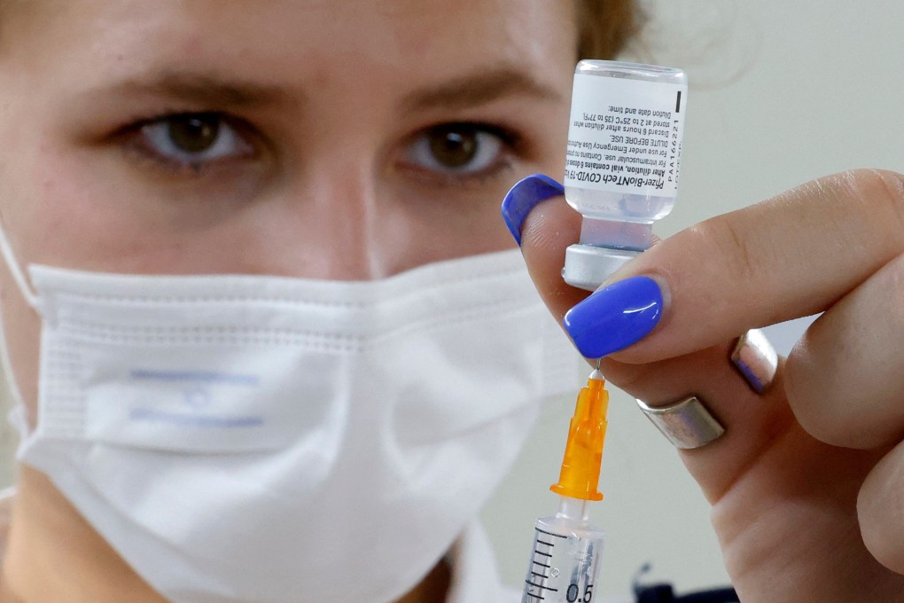 An Israeli medical worker prepares a dose of the Pfizer/BioNTech Covid-19 vaccine. Photo: AFP