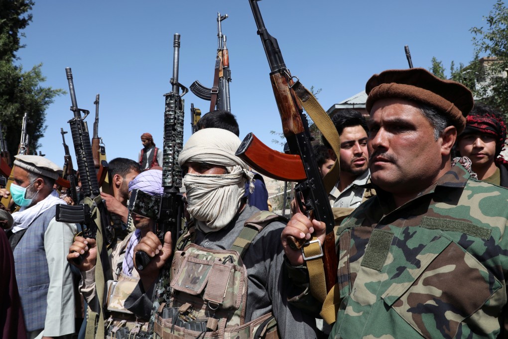 Armed men attend a gathering in Kabul to announce their support for Afghan security forces preparing to fight the Taliban in Afghanistan. Photo: Reuters