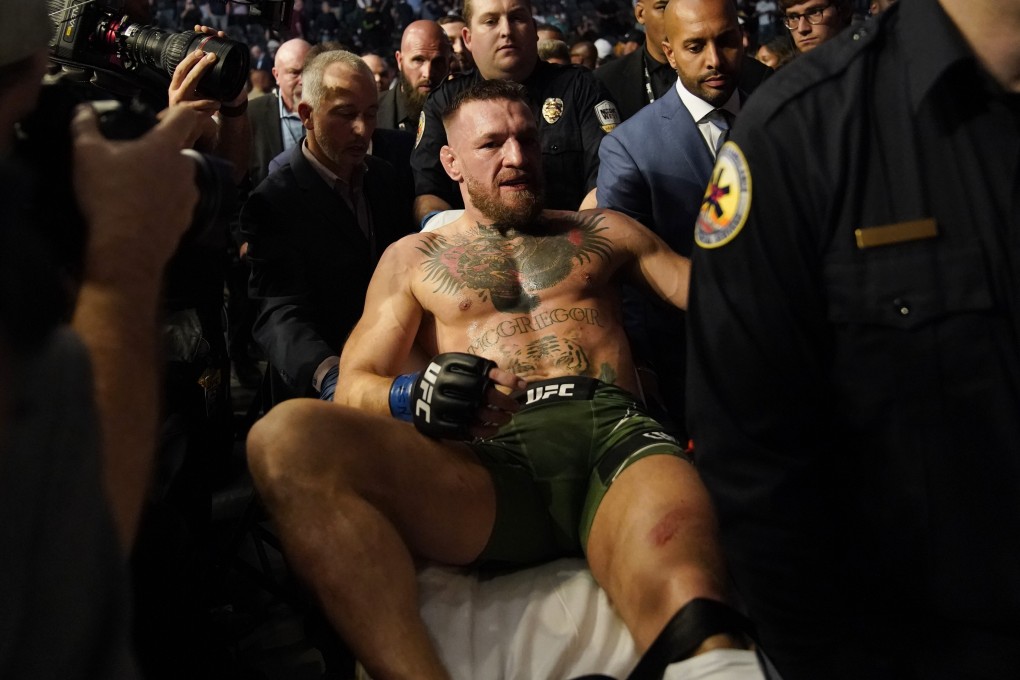 Conor McGregor is carried off on a stretcher after losing to Dustin Poirier in their UFC 264 lightweight main event. Photo: AP