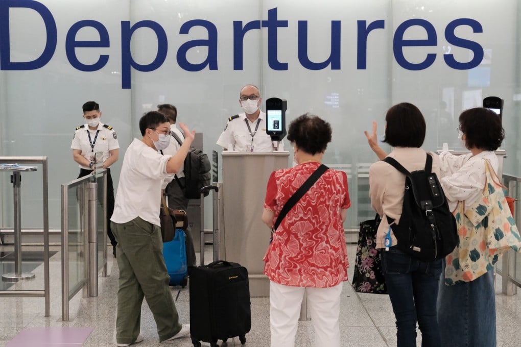 Family members bid farewell to those leaving Hong Kong for London at Hong Kong International Airport. Photo: Edmond So