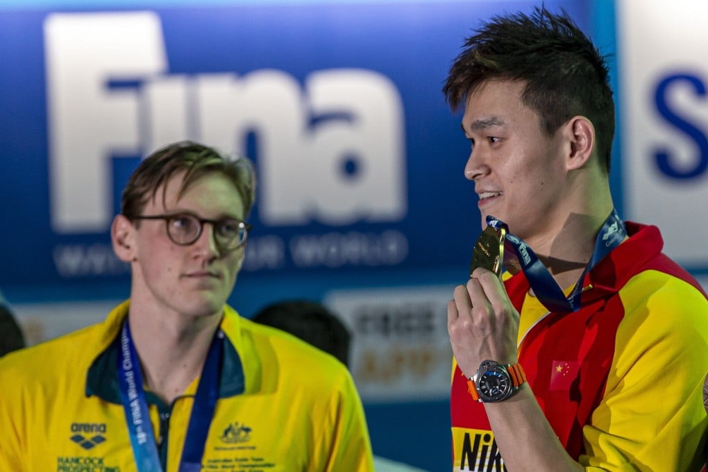 Mack Horton, of Australia, and winner Yang Sun, of China, at the podium medal awards after the men's 400m freestyle final at the Fina World Championships in Gwangju, South Korea in 2019. Photo: EPA