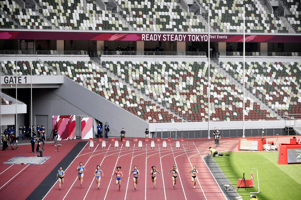 Japanese athletes compete in front of empty seats at the National Stadium in a test event for the 2020 Olympic Games. Photo: AP