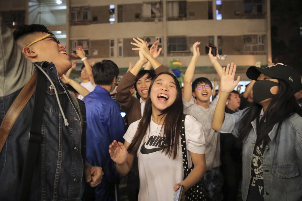 Opposition supporters celebrate their November 2019 landslide in district council elections. Less than two years later, many of those elected are in danger of being ousted from office. Photo: AP