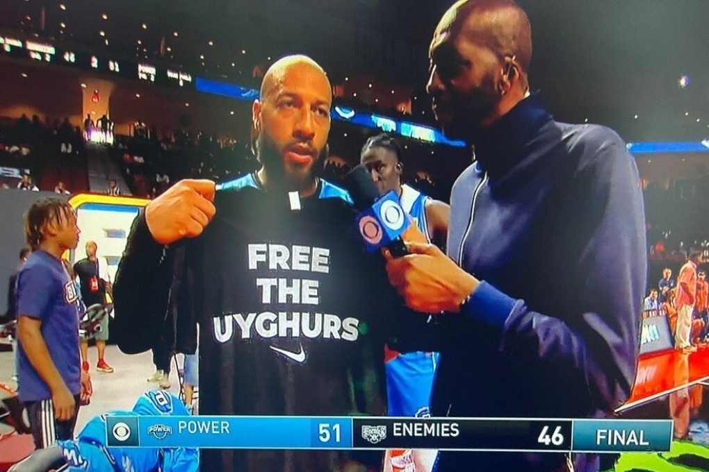Former NBA player Royce White holds up a T-shirt with the slogan “Free The Uygurs” during a postgame interview at the Big 3 basketball league season opener in Nevada on July 10, 2021. Photo: Twitter/@Highway_30