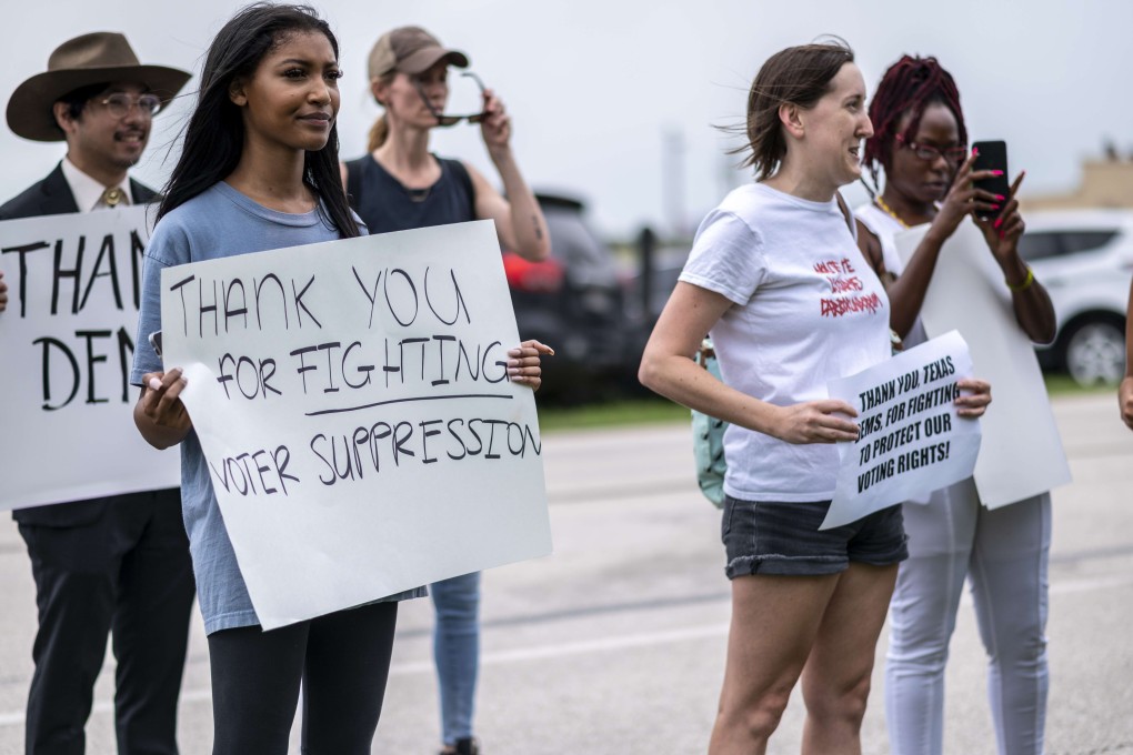 Supporters for Texas Democrats stand outside the Austin Bergstrom International Airport on Monday. Photo: AFP