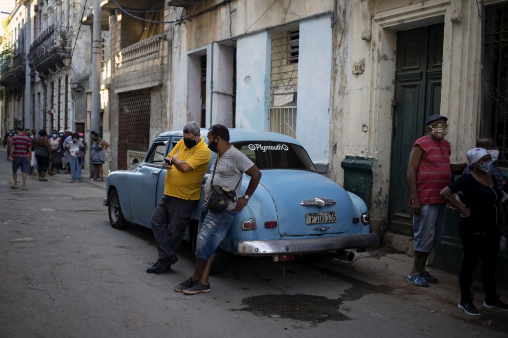 A man looks at his mobile phone in Havana, Cuba on Tuesday. On Monday Cuban authorities blocked some social media apps. Photo: AP