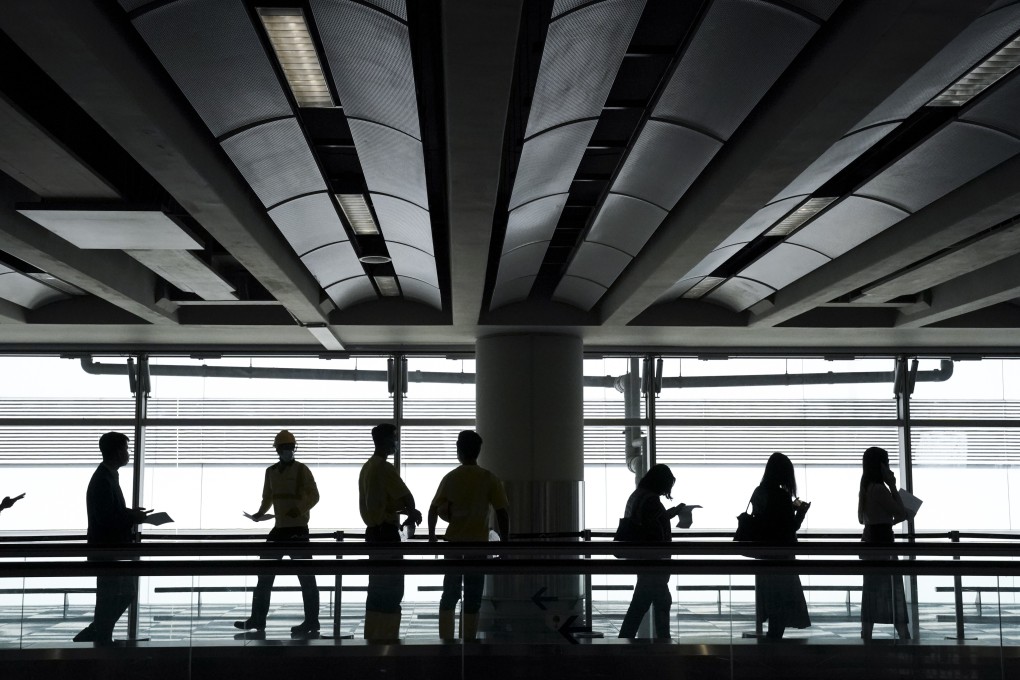 Airport workers queue up for Covid-19 testing. Photo: Felix Wong