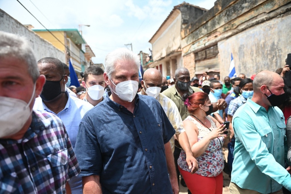 Cuban President Miguel Diaz-Canel (centre) is seen during a protest in San Antonio de los Banos on Sunday. Photo: AFP
