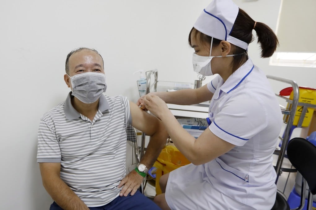 A man receives a coronavirus vaccine dose at a hospital in Hanoi. Less than 1 per cent of Vietnam’s population is fully vaccinated, mostly because of a lack of vaccine stocks. Photo: EPA-EFE