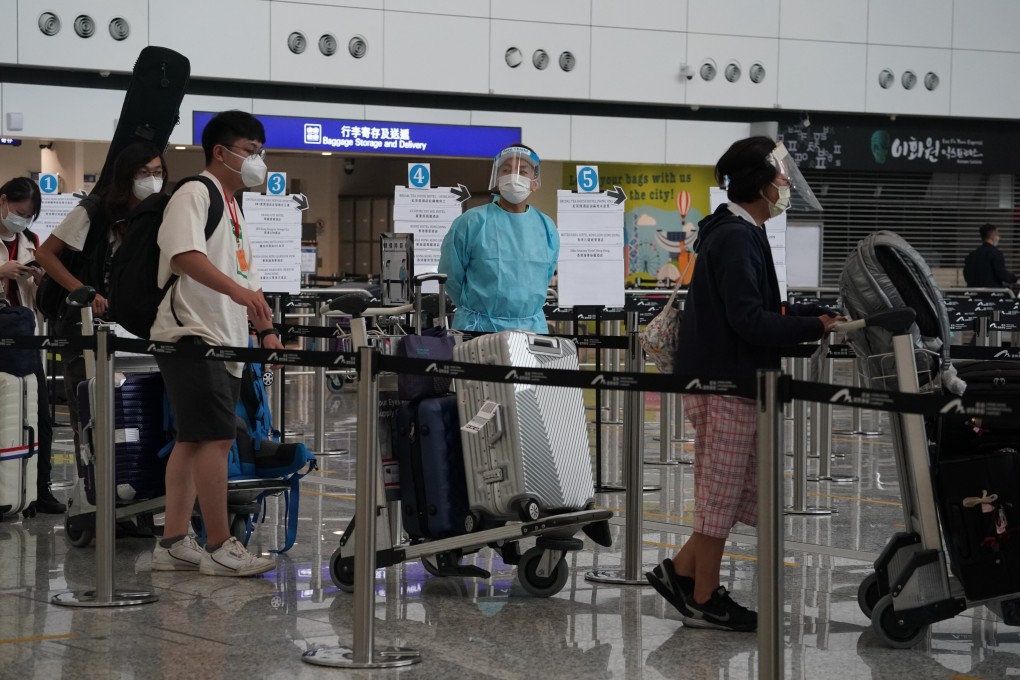Arrivals at Hong Kong International Airport wait to be taken to designated quarantine hotels. Photo: Felix Wong
