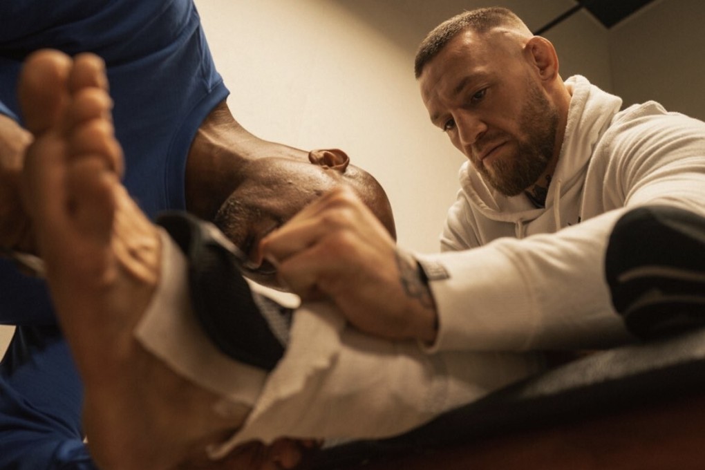 Conor McGregor receives treatment on his heavily-taped left ankle. Photo: Twitter/@TheNotoriousMMA