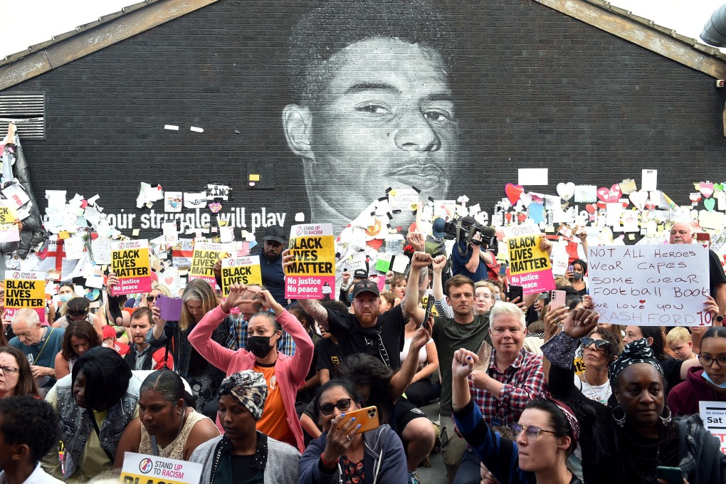 A ‘stand up to racism’ demonstration at the Marcus Rashford mural in Manchester, after it was defaced following the Euro 2020 final between Italy and England. Photo: Reuters
