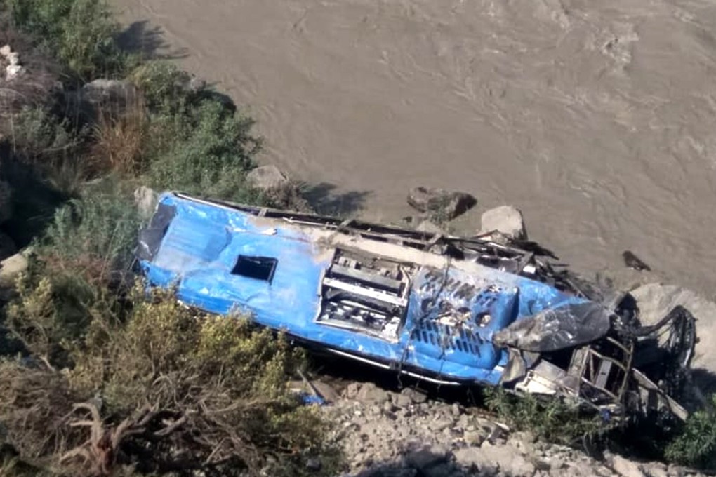 The wreckage of the bus that plunged into a ravine following the Wednesday blast. Photo: Xinhua