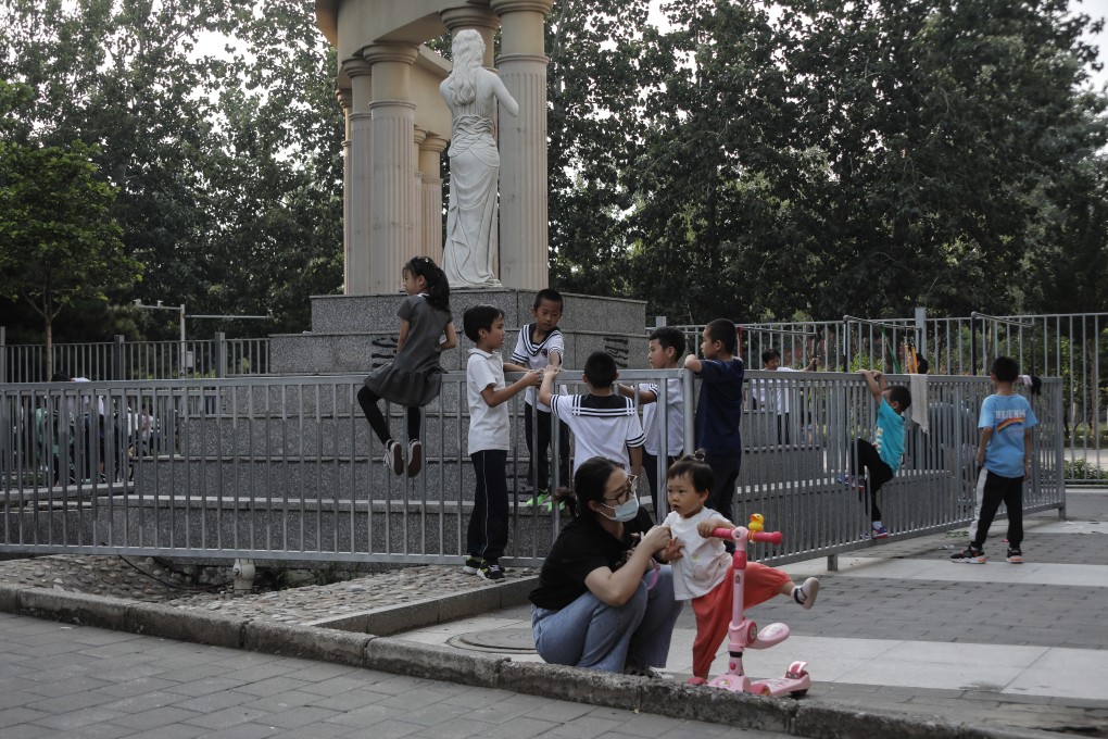 Children play in a residential area in Beijing. Changes to school enrollment policies has affected the prices of homes in the city’s top schools district. Photo: EPA-EFE