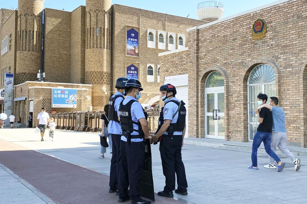 Police officers are deployed near the International Grand Bazaar in Urumqi in China’s Xinjiang Uygur autonomous region on July 1. Photo: Kyodo
