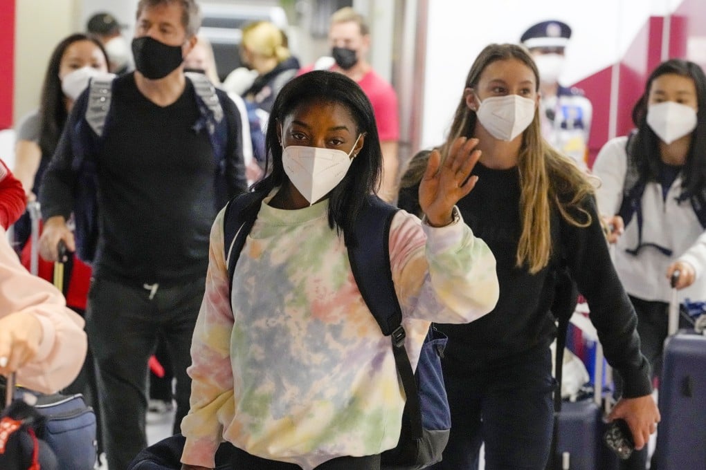 Simone Biles, centre, and the US Women‘s Gymnastics team arrive at Narita International Airport in Tokyo for the Olympic Games. Photo: AP