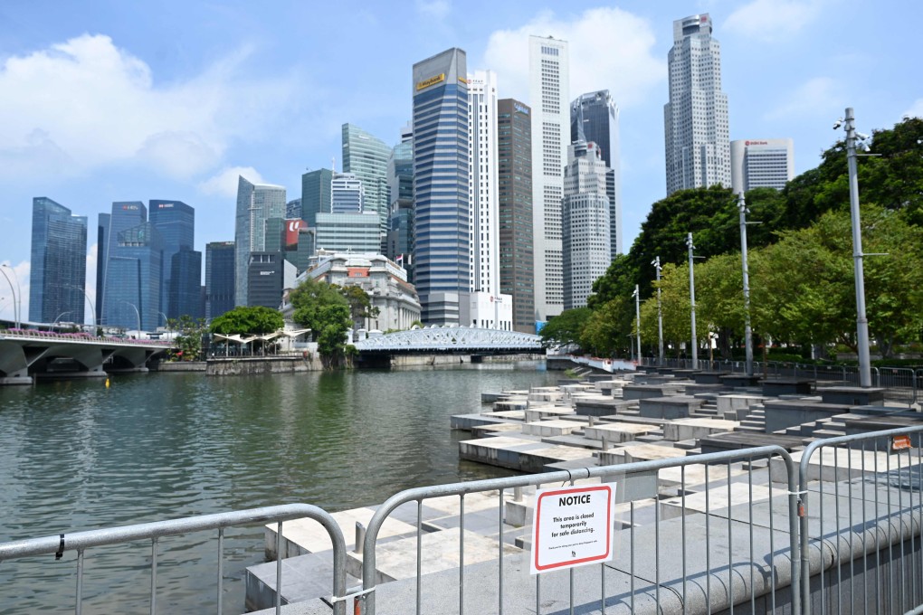 A public area on the Singapore River is temporarily closed. The city state has tightened its coronavirus restrictions as it tries to control a growing karaoke cluster. Photo: AFP