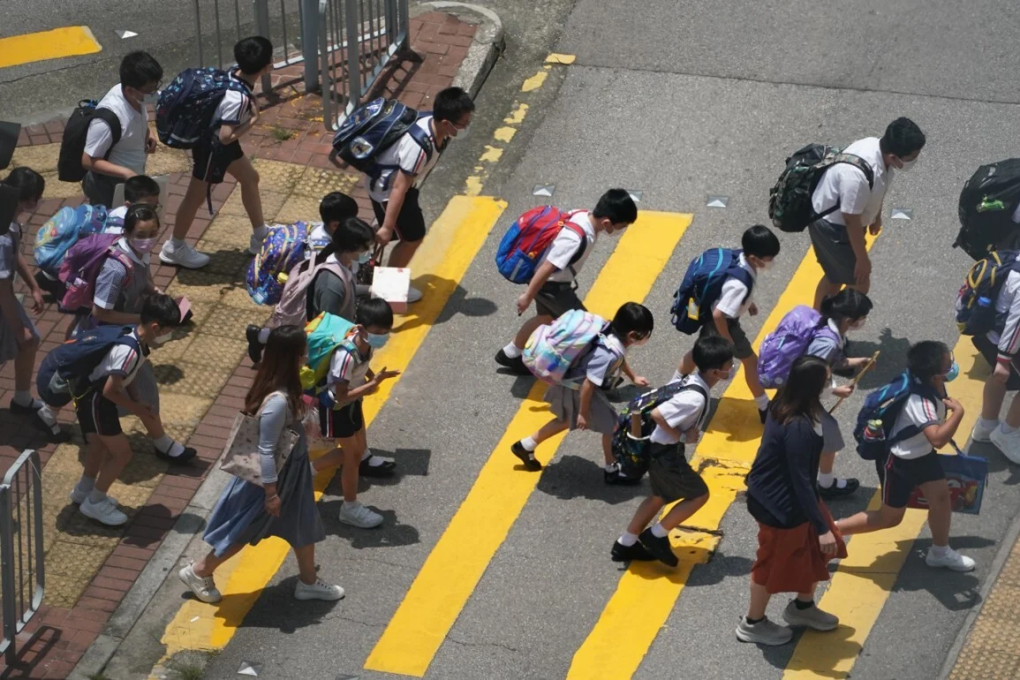 Primary school pupils cross the road at the end of school in Tsuen Wan. Photo: Felix Wong